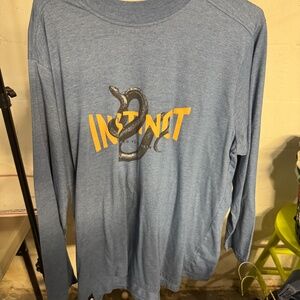 Winston long sleeve T-shirt with INSTINCT words on it.  Blue size XXL